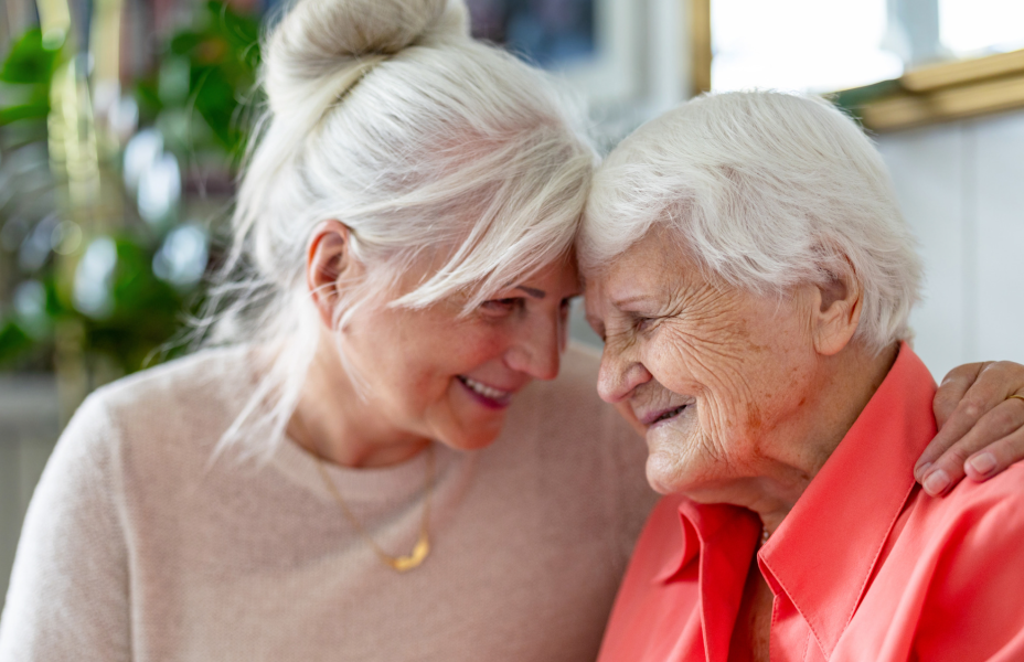 daugher embracing her older mother